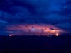 At Twilight, fissure 8 (right) 300 foot fountains as lava flows to Kapoho Beach (left)