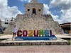 Me at the Cozumel sign.