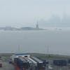 From our balcony waiting to set sail. The weather was yucky but I got a picture of Lady Liberty. Another must have picture 