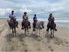 Riding horses along the beach was beautiful 