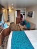 10772 is a standard amidships balcony stateroom. It is co figured with the bed bear the window rather than the door which I prefer as you don't have to crawl around the bed to get to the rest of the room.