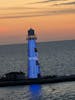 Beautiful sunset with the light house.   