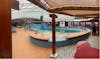 Lido deck retractable roof over pool and stage for live entertainment 