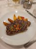 Mediterranean steak with potato wedges, diced veggie medley, and chimichurri sauce.