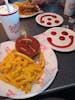 The picture speaks for itself. The waiter made the smiley face out of ketchup.