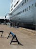 Crew painting the ship while in port at Sydney, Nova Scotia on July 24, 2024