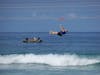 Hatian Fisherman watch zipliners on Labadee