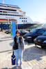 My wife  in front of our ship, ms Rotterdam, in Cadiz, Spain. 
