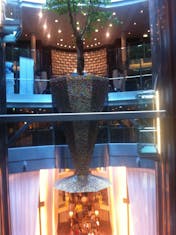 a mosaic planter, the centerpiece between the glass elevators