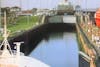 Preparing to enter the first lock, behind a cargo ship.