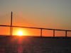 Sunset going under Tampa Bay Bridge