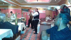 The dining staff performing their nightly dance.