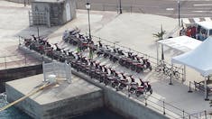 Scooters parked by the ship