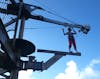 My wife on the ropes course walking the plank.