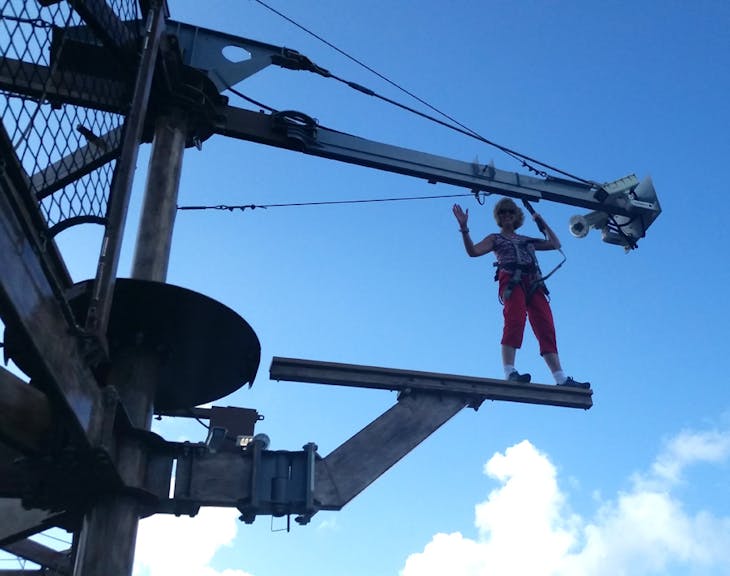 My wife on the ropes course walking the plank. - Norwegian Getaway