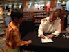 Captain Robert w/ my boy signing his Disney cruise momento