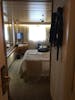 View into stateroom at entrance door. Bath on right, closets on left.