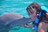 Kissing a dolphin in Cozumel