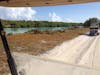 Old cars were dumped at the end of this road on that inlet