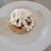 Appetizer of shrimp on a cornmeal tortilla with lettuce and cream