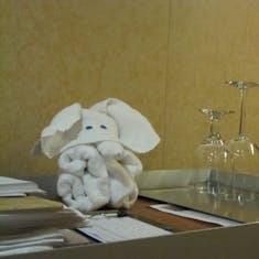 Mini towel elephant on cleaning cart.