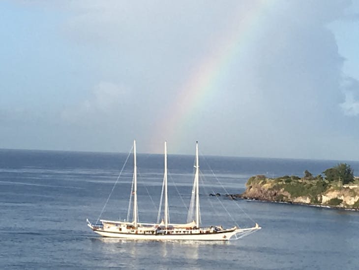 Rainbow over sailing ship - Celebrity Reflection