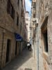 Small street with view of cathedral in Dubrovnik