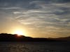 Sunset behind Nea Kameni (Caldera) in Santorini