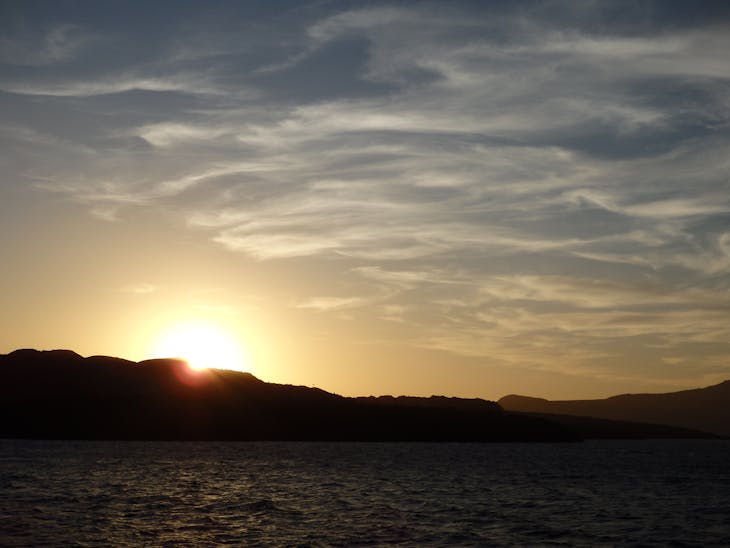 Sunset behind Nea Kameni (Caldera) in Santorini - Star Flyer