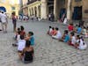 Kids at recess playing at a public square.