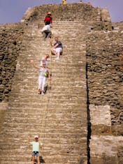 Belize City, Belize - Climbing the pyramid at Lamanai