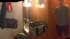 Part of a Panoramic photo. Hooks for bags and things, another mirror, mini fridge cabinet, and my husband again. You can even see the towel Animal's legs hanging from the ceiling. 