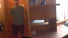 Part of a Panoramic photo. Including my husband! The vanity area, door, and cabinet to the safe.
