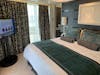 Bedroom in the Norwegian Breakaway Deluxe Owner's Suite (Category H2)