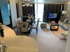 Living room in the Norwegian Breakaway Deluxe Owner's Suite (Category H2)