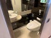 Guest bathroom in the Norwegian Breakaway Deluxe Owner's Suite (Category H2)