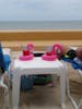 Looking out at beach with our flamingo drink holders