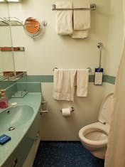 Deluxe Oceanview main washroom w/ sink, toilet and shower