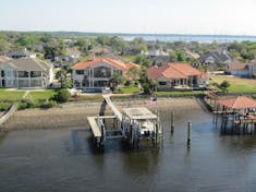 Homes along the St John's river.  People stand on their patios and wave as the ship passes.