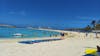 white sand beach, ship in background