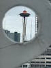 Space Needle through the eye of The Seattle Great Wheel. 