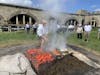 STAFF AT FT. ADAMS DEMONSTRATING HOW THEY PREPARE THE CLAMBAKE