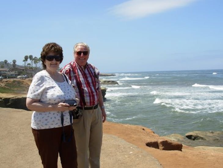 Anita & Jim standing by the Pacific Ocean in San Diego CA - Radiance of the Seas