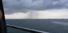 A distant thunder shower (and it did rain as we left the Caymans).  (Equinox)