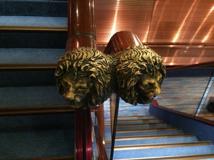 Lion head decor at the end of the stairwell - Carnival Sunshine